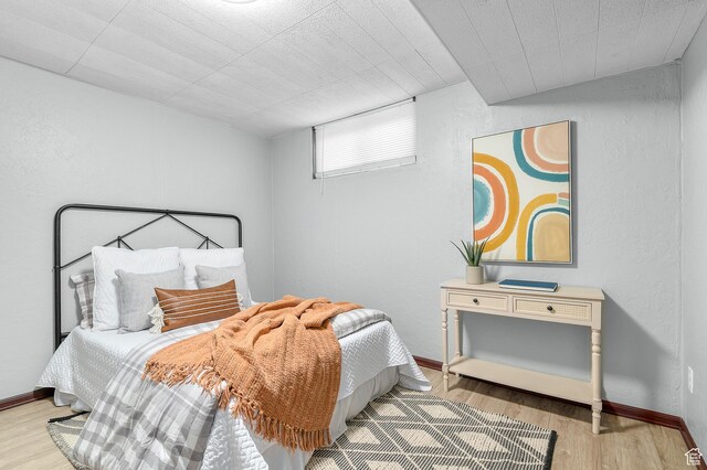 6888 S 455 E, Midvale, UT 84047 - bedroom with a textured wall and wood finished floors
