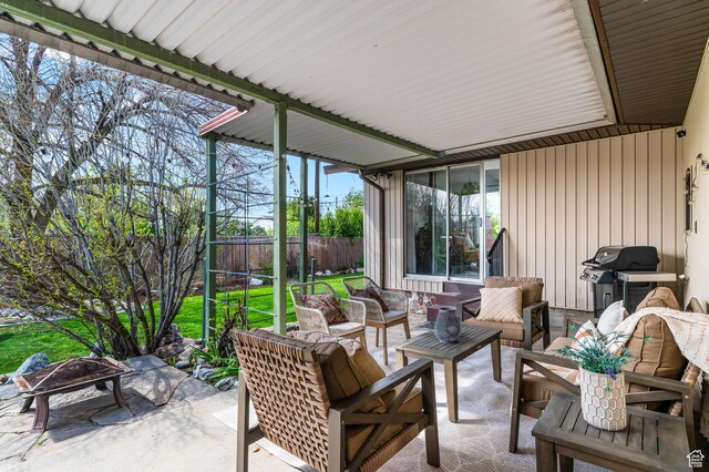 6888 S 455 E, Midvale, UT 84047 - sunroom featuring an outdoor living space with a fire pit