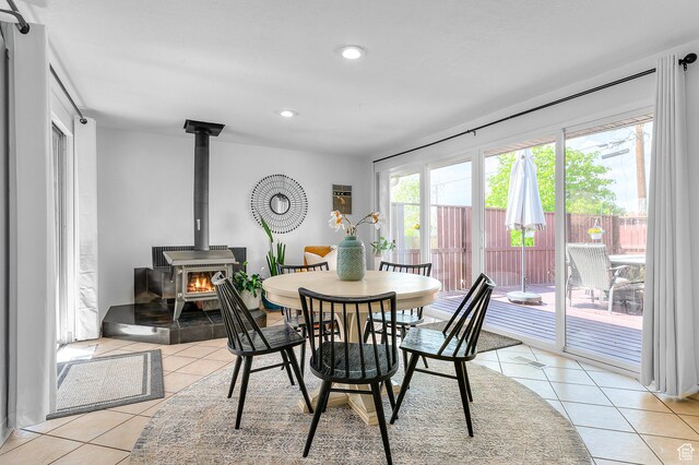 6888 S 455 E, Midvale, UT 84047 - dining space with a wood stove, recessed lighting, and light tile patterned flooring