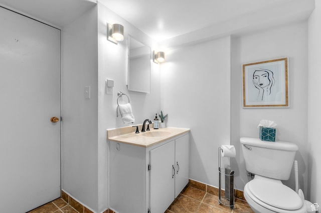 6888 S 455 E, Midvale, UT 84047 - half bath with vanity, baseboards, tile patterned flooring, and toilet