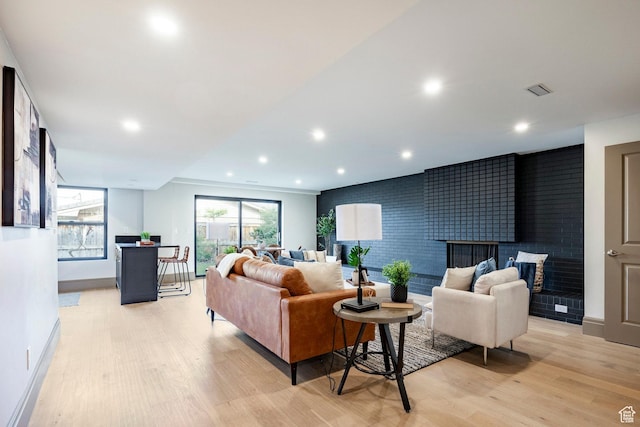 2568 E Sherwood Dr, Salt Lake City, UT 84108 - living room with baseboards, a fireplace, recessed lighting, and light wood-style flooring