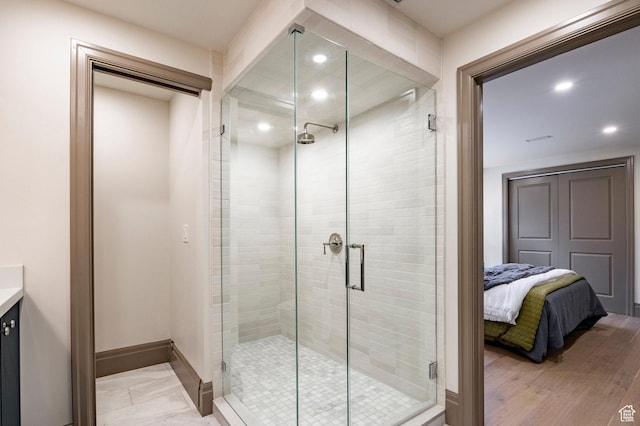 2568 E Sherwood Dr, Salt Lake City, UT 84108 - ensuite bathroom featuring vanity, baseboards, a shower stall, and recessed lighting