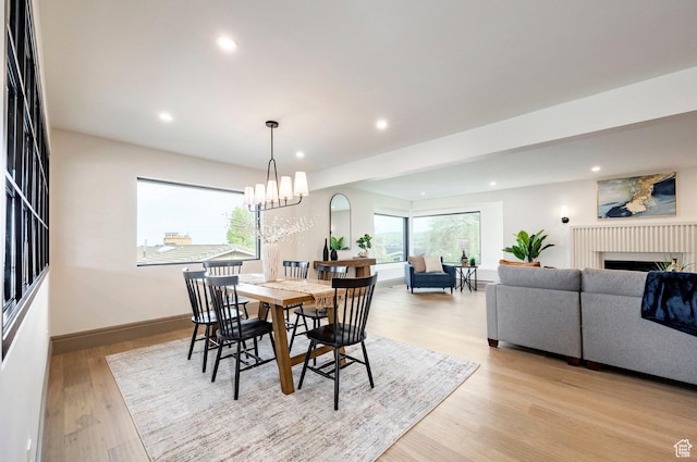 2568 E Sherwood Dr, Salt Lake City, UT 84108 - dining space featuring recessed lighting, light wood finished floors, baseboards, and a fireplace