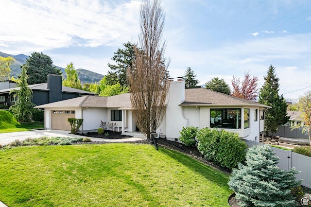 2568 E Sherwood Dr, Salt Lake City, UT 84108 - single story home featuring fence, a garage, a front yard, a chimney, and concrete driveway