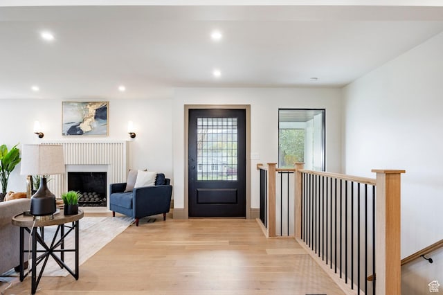 2568 E Sherwood Dr, Salt Lake City, UT 84108 - entryway featuring light wood-style floors, recessed lighting, and a fireplace