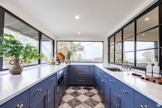 2568 E Sherwood Dr, Salt Lake City, UT 84108 - kitchen featuring plenty of natural light, a sink, and blue cabinets