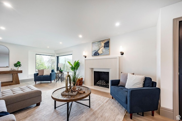 2568 E Sherwood Dr, Salt Lake City, UT 84108 - living room with a fireplace, recessed lighting, and light wood-style flooring