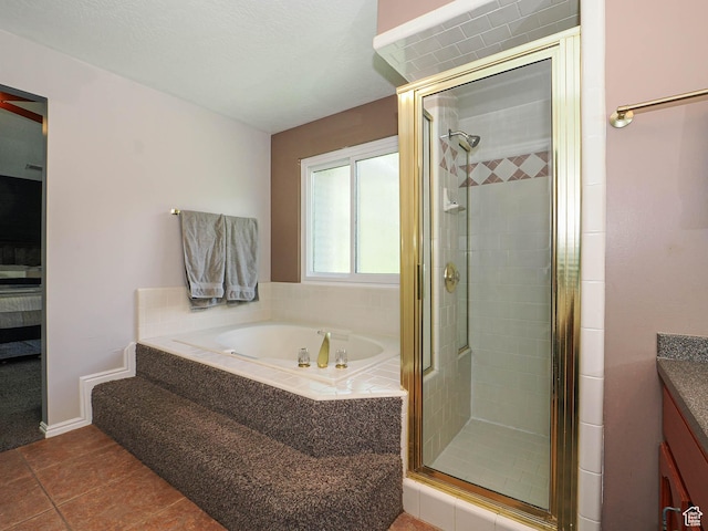 full bathroom featuring tile patterned floors, a shower stall, and a bath