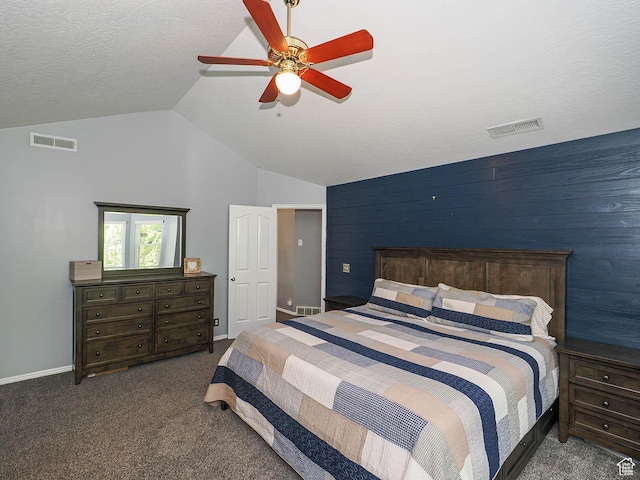 carpeted bedroom featuring ceiling fan, visible vents, and lofted ceiling