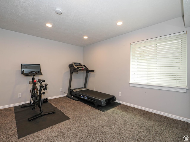 exercise area featuring carpet floors, recessed lighting, and baseboards