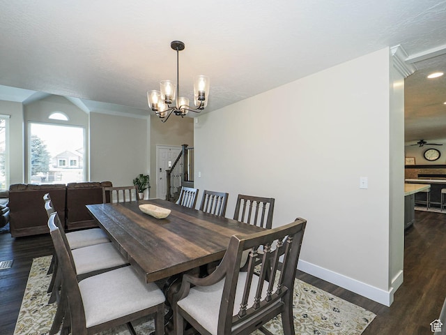dining space with dark wood-style flooring, baseboards, a notable chandelier, and recessed lighting