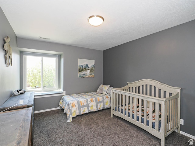 bedroom featuring visible vents, carpet flooring, and baseboards