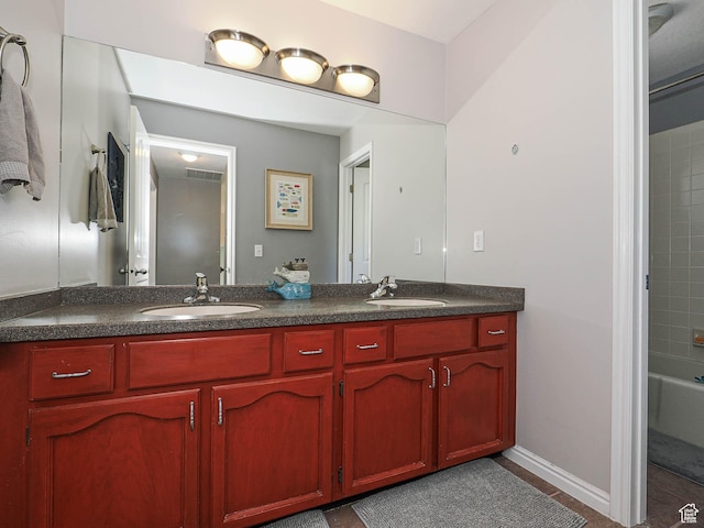 full bathroom featuring double vanity, a sink, shower / bath combination, and tile patterned floors