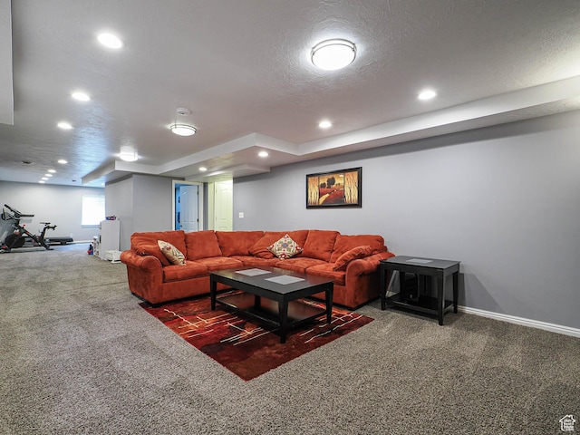 living area with baseboards, carpet flooring, a textured ceiling, and recessed lighting