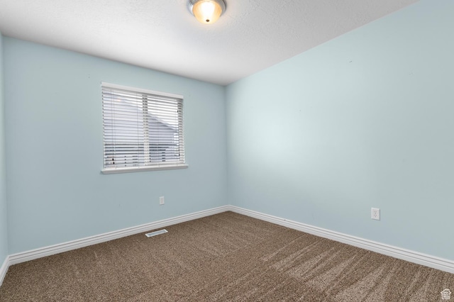 2135 N 130 W, Tooele, UT 84074 - empty room featuring baseboards, carpet, and visible vents