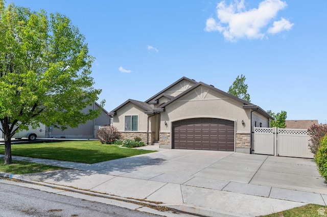 2135 N 130 W, Tooele, UT 84074 - ranch-style home with stone siding, a garage, stucco siding, a front yard, and concrete driveway