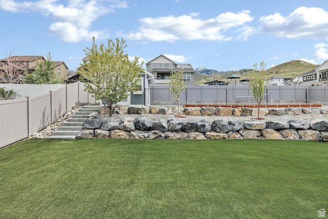 590 S 1030 E, Smithfield, UT 84335 - view of yard featuring a residential view, stairs, and a fenced backyard