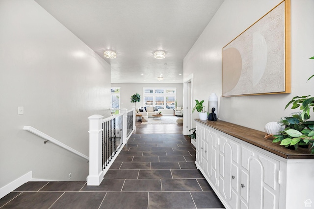 590 S 1030 E, Smithfield, UT 84335 - hallway with baseboards, an upstairs landing, and tile patterned flooring