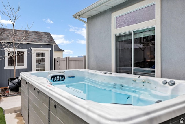 590 S 1030 E, Smithfield, UT 84335 - exterior space featuring a hot tub, fence, and an outbuilding