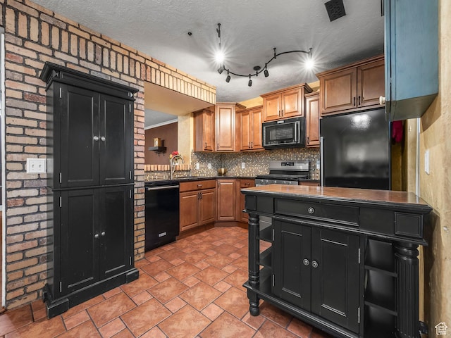1286 W Glenbarr, Springville, UT 84663 - kitchen with brown cabinetry, dark countertops, dark cabinetry, backsplash, and black appliances