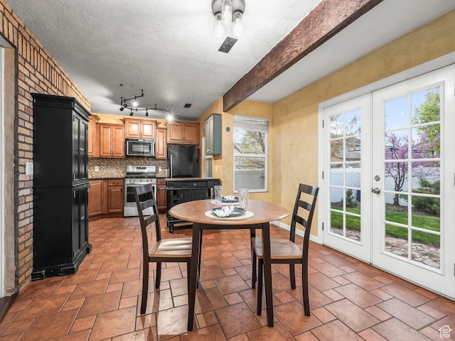 1286 W Glenbarr, Springville, UT 84663 - dining room with french doors, a textured ceiling, beam ceiling, and stone tile flooring