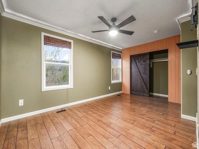 1286 W Glenbarr, Springville, UT 84663 - unfurnished bedroom featuring visible vents, ornamental molding, light wood finished floors, and multiple windows