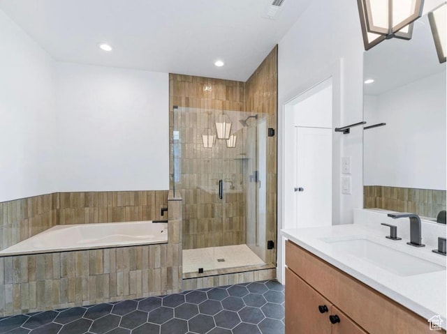 11436 S Watercourse Rd Unit 110, South Jordan, UT 84009 - full bath featuring tile patterned floors, recessed lighting, visible vents, a garden tub, and a stall shower