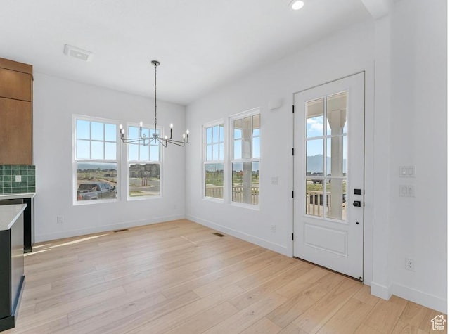 11436 S Watercourse Rd Unit 110, South Jordan, UT 84009 - unfurnished dining area featuring light wood-style floors, a chandelier, recessed lighting, baseboards, and visible vents