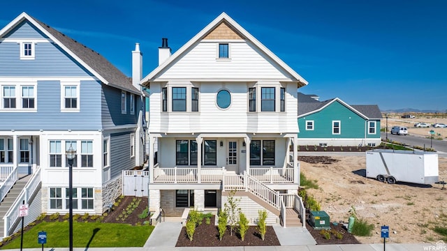 11436 S Watercourse Rd Unit 110, South Jordan, UT 84009 - view of front of property with a porch, stairs, and stone siding