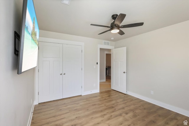 3171 N Crest Dr, Lehi, UT 84043 - unfurnished bedroom with ceiling fan, light wood-style flooring, baseboards, visible vents, and a closet