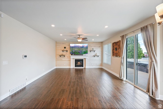 3171 N Crest Dr, Lehi, UT 84043 - unfurnished living room featuring a ceiling fan, visible vents, baseboards, a glass covered fireplace, and recessed lighting