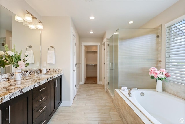 3171 N Crest Dr, Lehi, UT 84043 - bathroom with a garden tub, a shower stall, vanity, a spacious closet, and recessed lighting