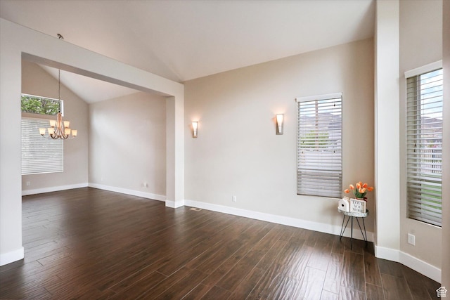 3171 N Crest Dr, Lehi, UT 84043 - spare room featuring dark wood-type flooring, lofted ceiling, a notable chandelier, and a healthy amount of sunlight