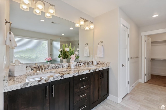 3171 N Crest Dr, Lehi, UT 84043 - full bathroom with a sink, a walk in closet, double vanity, and visible vents