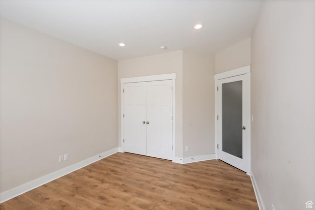 3171 N Crest Dr, Lehi, UT 84043 - unfurnished bedroom featuring recessed lighting, baseboards, light wood-style flooring, and a closet