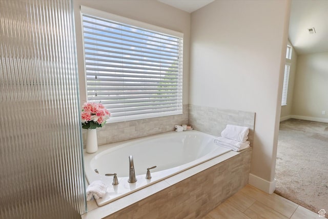 3171 N Crest Dr, Lehi, UT 84043 - bathroom with baseboards, a garden tub, and visible vents