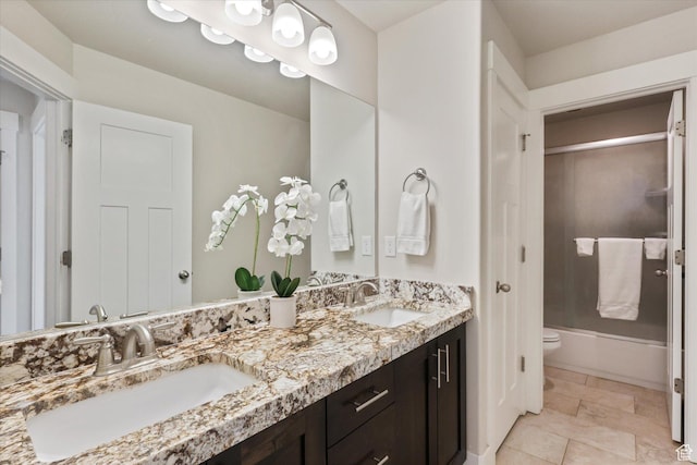 3171 N Crest Dr, Lehi, UT 84043 - bathroom featuring double vanity, a sink, bath / shower combo with glass door, and toilet