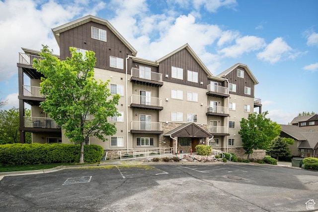 5012 S Tiimber Way Unit 415, Holladay, UT 84117 - view of property featuring uncovered parking