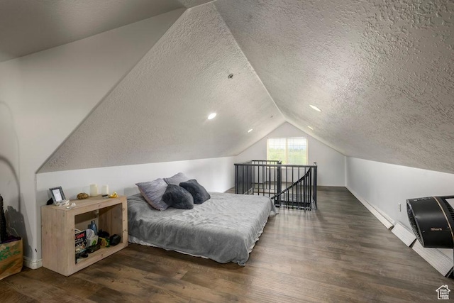 5012 S Tiimber Way Unit 415, Holladay, UT 84117 - bedroom featuring wood finished floors, baseboards, a textured ceiling, and lofted ceiling