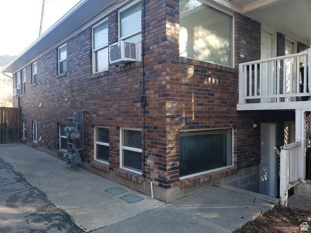 268 W 700 N, Salt Lake City, UT 84103 - view of home's exterior featuring brick siding, cooling unit, and a balcony