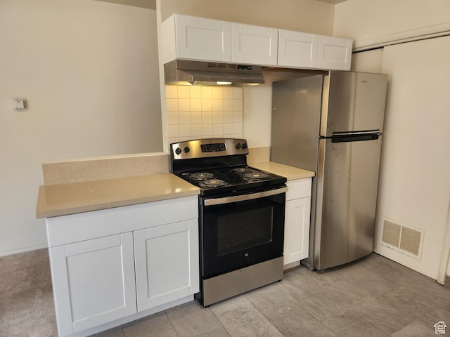 268 W 700 N, Salt Lake City, UT 84103 - kitchen featuring backsplash, visible vents, white cabinets, under cabinet range hood, and stainless steel appliances