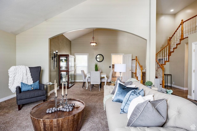 10944 S Surrey Meadow Cv, South Jordan, UT 84095 - carpeted living room featuring arched walkways, stairs, and baseboards