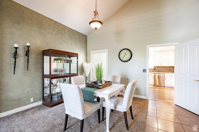 10944 S Surrey Meadow Cv, South Jordan, UT 84095 - dining space featuring high vaulted ceiling, light tile patterned floors, and baseboards