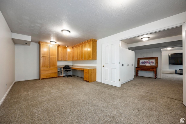 10944 S Surrey Meadow Cv, South Jordan, UT 84095 - unfurnished office featuring built in study area, light colored carpet, baseboards, and a textured ceiling
