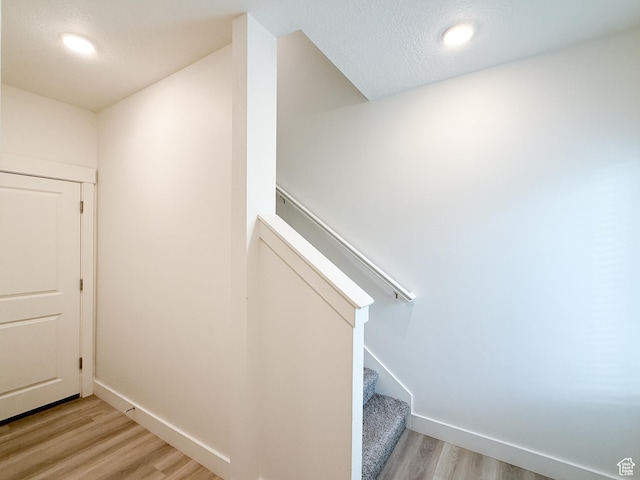 1776 N 300 E Unit 106, North Ogden, UT 84414 - staircase featuring recessed lighting, baseboards, and wood finished floors