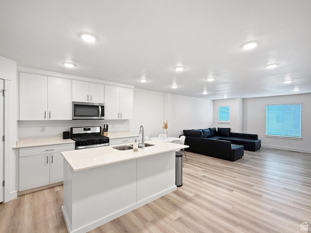 1776 N 300 E Unit 106, North Ogden, UT 84414 - kitchen with a sink, light countertops, stainless steel appliances, and light wood-style flooring