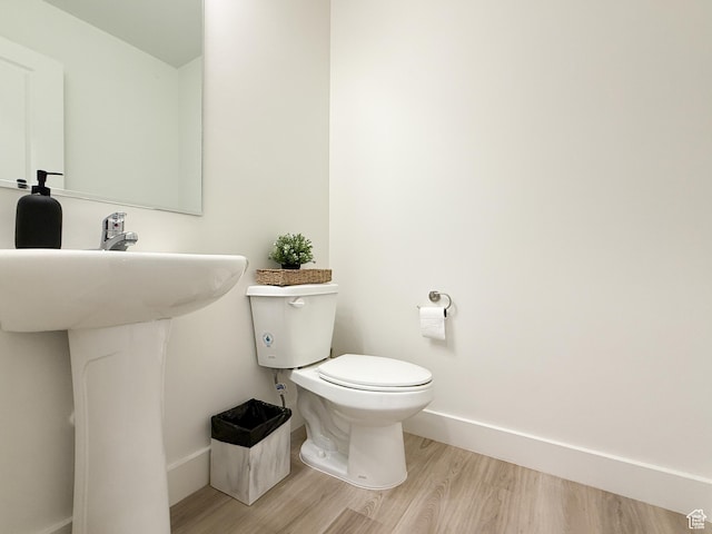 1776 N 300 E Unit 106, North Ogden, UT 84414 - bathroom featuring toilet, baseboards, and wood finished floors
