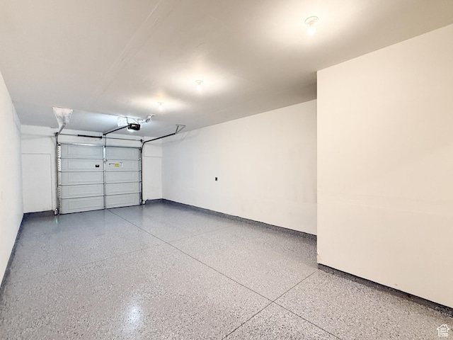 1776 N 300 E Unit 106, North Ogden, UT 84414 - garage featuring baseboards and a garage door opener