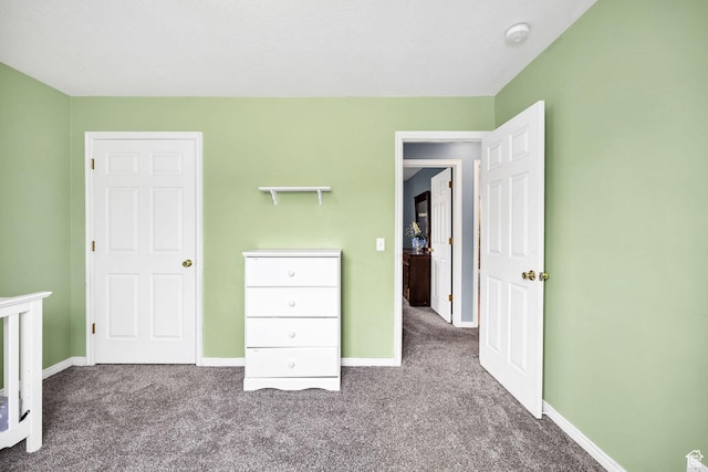811 S Park Ave W, Logan, UT 84321 - unfurnished bedroom featuring baseboards and carpet