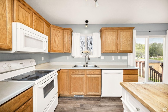 811 S Park Ave W, Logan, UT 84321 - kitchen featuring a sink, white appliances, dark wood-style floors, and visible vents